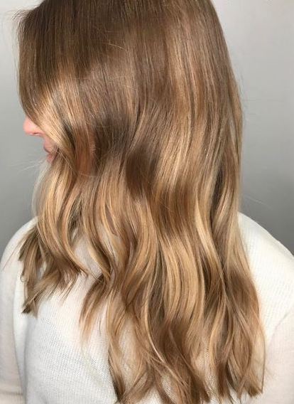 Toffee blonde hair with root melt
